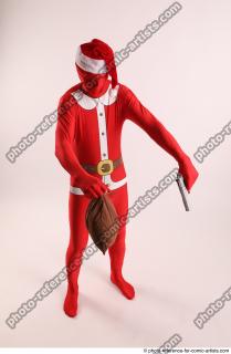 16 2019 01 JOEL ADAMSON CHRISTMASVILLAIN WITH GUN AND BAG